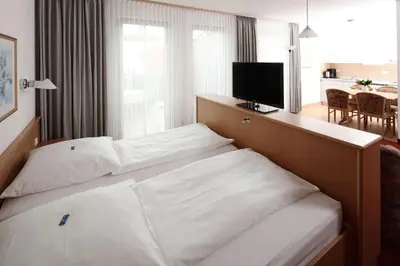 Ein Bett oder Betten in einem Zimmer der Unterkunft Appartement-Hotel Sibyllenbad