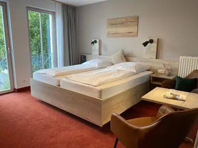Ein Bett oder Betten in einem Zimmer der Unterkunft Appartement-Hotel Sibyllenbad