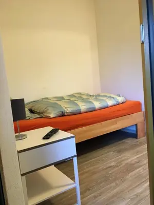 Ein Bett oder Betten in einem Zimmer der Unterkunft Pension Jägerschenke