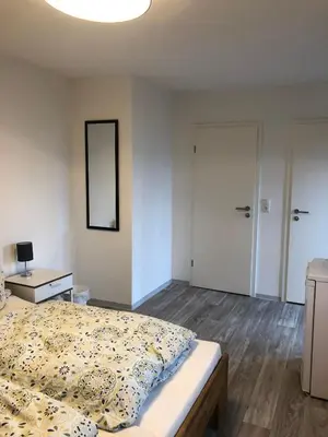 Ein Bett oder Betten in einem Zimmer der Unterkunft Pension Jägerschenke