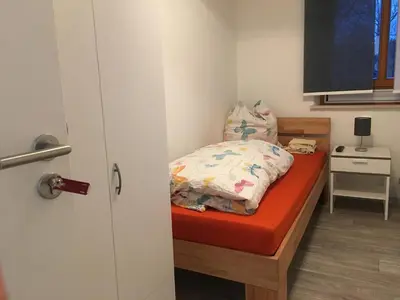 Ein Bett oder Betten in einem Zimmer der Unterkunft Pension Jägerschenke