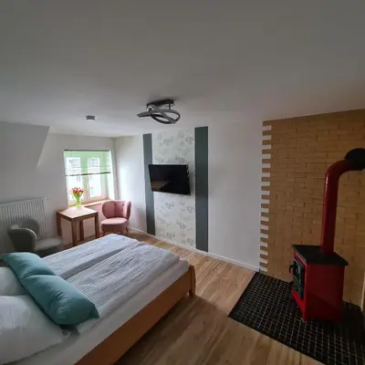 Ein Bett oder Betten in einem Zimmer der Unterkunft Gästezimmer Treuen - Bed & Breakfast