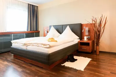 Ein Bett oder Betten in einem Zimmer der Unterkunft City Hotel Roding