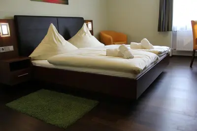 Ein Bett oder Betten in einem Zimmer der Unterkunft Hotel Brantl