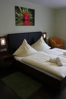 Ein Bett oder Betten in einem Zimmer der Unterkunft Hotel Brantl