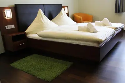 Ein Bett oder Betten in einem Zimmer der Unterkunft Hotel Brantl