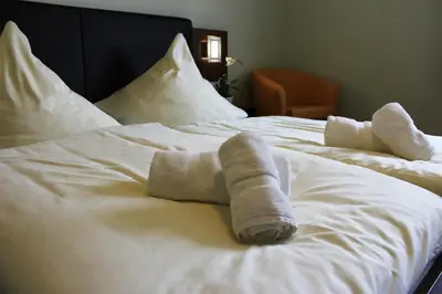 Ein Bett oder Betten in einem Zimmer der Unterkunft Hotel Brantl