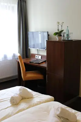 Ein Bett oder Betten in einem Zimmer der Unterkunft Hotel Brantl