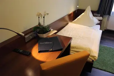 Ein Bett oder Betten in einem Zimmer der Unterkunft Hotel Brantl