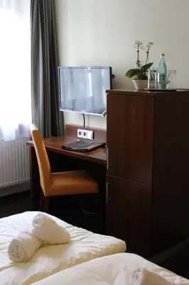 Ein Bett oder Betten in einem Zimmer der Unterkunft Hotel Brantl