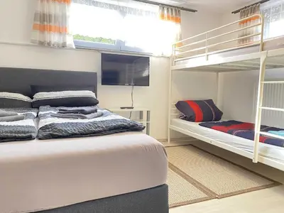 Ein Bett oder Betten in einem Zimmer der Unterkunft Ferienwohnungen Reiger - WA320