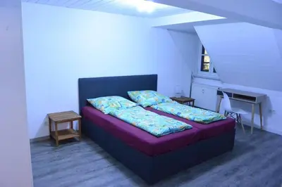 Ein Bett oder Betten in einem Zimmer der Unterkunft Ferienwohnung 