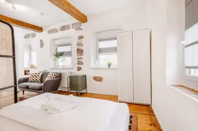 Ein Bett oder Betten in einem Zimmer der Unterkunft Am Weissen Turm