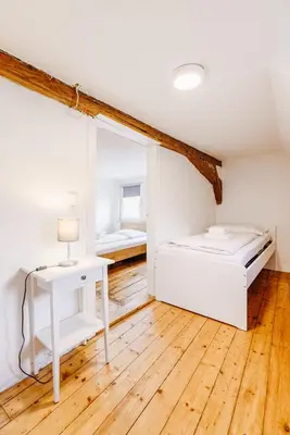 Ein Bett oder Betten in einem Zimmer der Unterkunft Am Weissen Turm