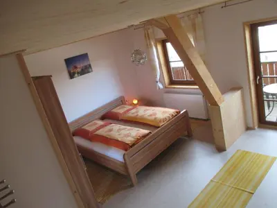 Ein Bett oder Betten in einem Zimmer der Unterkunft Bärenhof