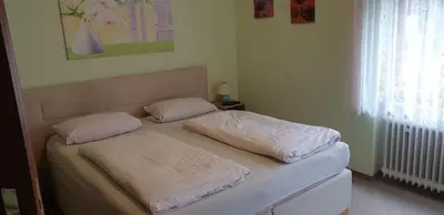 Ein Bett oder Betten in einem Zimmer der Unterkunft Landgasthof Peterhof