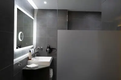 Ein Badezimmer in der Unterkunft Hotel & Apartments Böhm