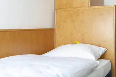 Ein Bett oder Betten in einem Zimmer der Unterkunft Hotel & Apartments Böhm