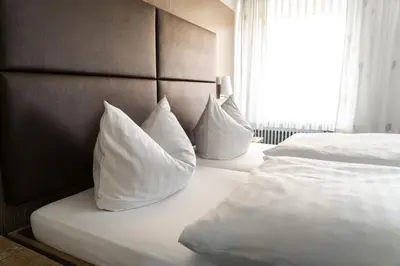 Ein Bett oder Betten in einem Zimmer der Unterkunft Hotel & Apartments Böhm