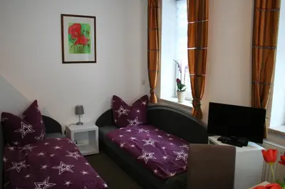 Ein Bett oder Betten in einem Zimmer der Unterkunft Ferienwohnung am Mühlbach