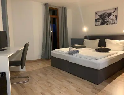 Ein Bett oder Betten in einem Zimmer der Unterkunft Parkhotel Cham