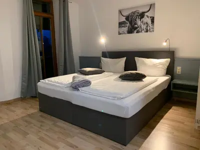 Ein Bett oder Betten in einem Zimmer der Unterkunft Parkhotel Cham
