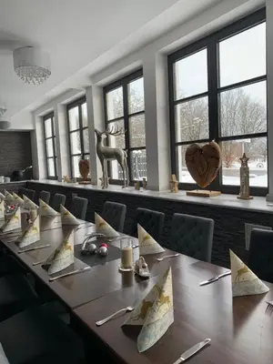 Ein Restaurant oder anderes Speiselokal in der Unterkunft Parkhotel Cham