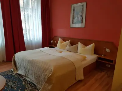 Ein Bett oder Betten in einem Zimmer der Unterkunft Hotel Am Kuhbogen