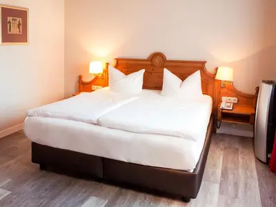 Ein Bett oder Betten in einem Zimmer der Unterkunft DORMERO Hotel Plauen