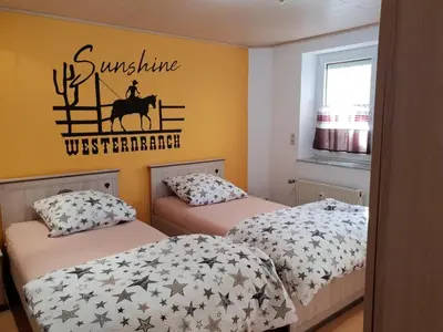 Ein Bett oder Betten in einem Zimmer der Unterkunft Sunshine Westernranch