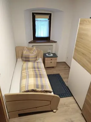 Ein Bett oder Betten in einem Zimmer der Unterkunft Ferienwohnung am Marktplatz
