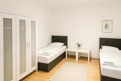 Ein Bett oder Betten in einem Zimmer der Unterkunft SUNNYHOME Monteurwohnungen und Apartments in Weiden