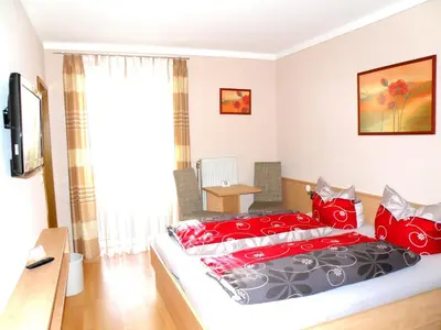 Ein Bett oder Betten in einem Zimmer der Unterkunft Zum Schwarzen Bären