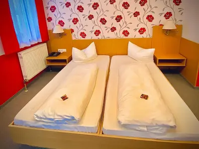 Ein Bett oder Betten in einem Zimmer der Unterkunft Fichtel-Hotel by Meister Bär