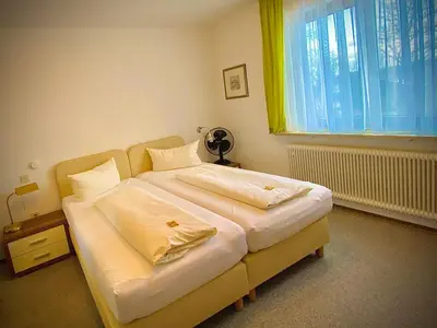 Ein Bett oder Betten in einem Zimmer der Unterkunft Fichtel-Hotel by Meister Bär