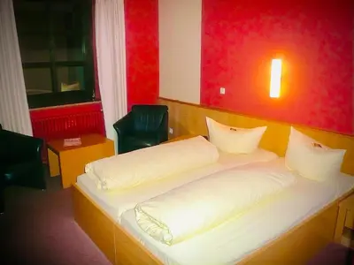 Ein Bett oder Betten in einem Zimmer der Unterkunft Fichtel-Hotel by Meister Bär