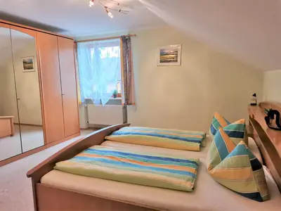 Ein Bett oder Betten in einem Zimmer der Unterkunft Ferienwohnung Träxler