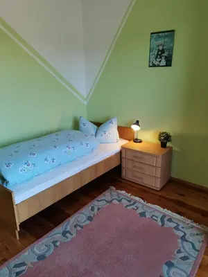 Ein Bett oder Betten in einem Zimmer der Unterkunft Ferienwohnung Träxler