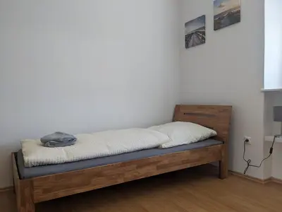 Ein Bett oder Betten in einem Zimmer der Unterkunft Monteurunterkunft Windischeschenbach by HausGruenerBaum
