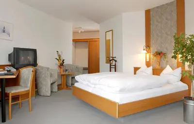 Ein Bett oder Betten in einem Zimmer der Unterkunft Hotel Rossner