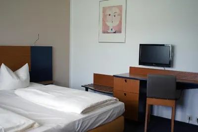 Ein Bett oder Betten in einem Zimmer der Unterkunft Motel Hormersdorf