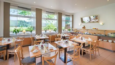 Ein Restaurant oder anderes Speiselokal in der Unterkunft Motel Hormersdorf