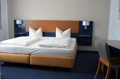 Ein Bett oder Betten in einem Zimmer der Unterkunft Motel Hormersdorf