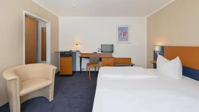 Ein Bett oder Betten in einem Zimmer der Unterkunft Motel Hormersdorf