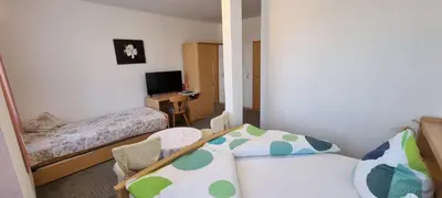 Ein Bett oder Betten in einem Zimmer der Unterkunft Gasthof Landhaus Adorf