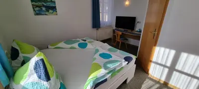 Ein Bett oder Betten in einem Zimmer der Unterkunft Gasthof Landhaus Adorf