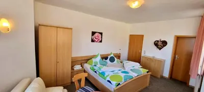 Ein Bett oder Betten in einem Zimmer der Unterkunft Gasthof Landhaus Adorf