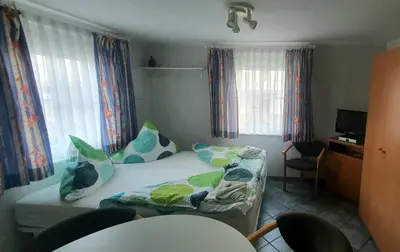Ein Bett oder Betten in einem Zimmer der Unterkunft Miniferienhaus Bad Elster