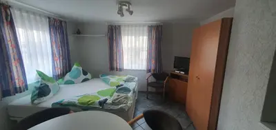 Ein Bett oder Betten in einem Zimmer der Unterkunft Miniferienhaus Bad Elster