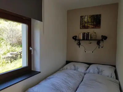 Ein Bett oder Betten in einem Zimmer der Unterkunft Ferienwohnung Wegespinne